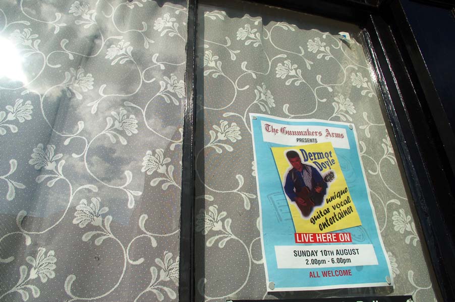Advert in a pub window, Bath Street.
