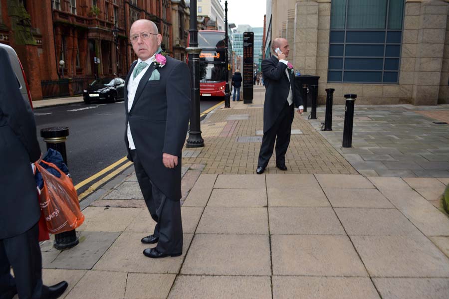 Man with a pink rose, Edmund Street.